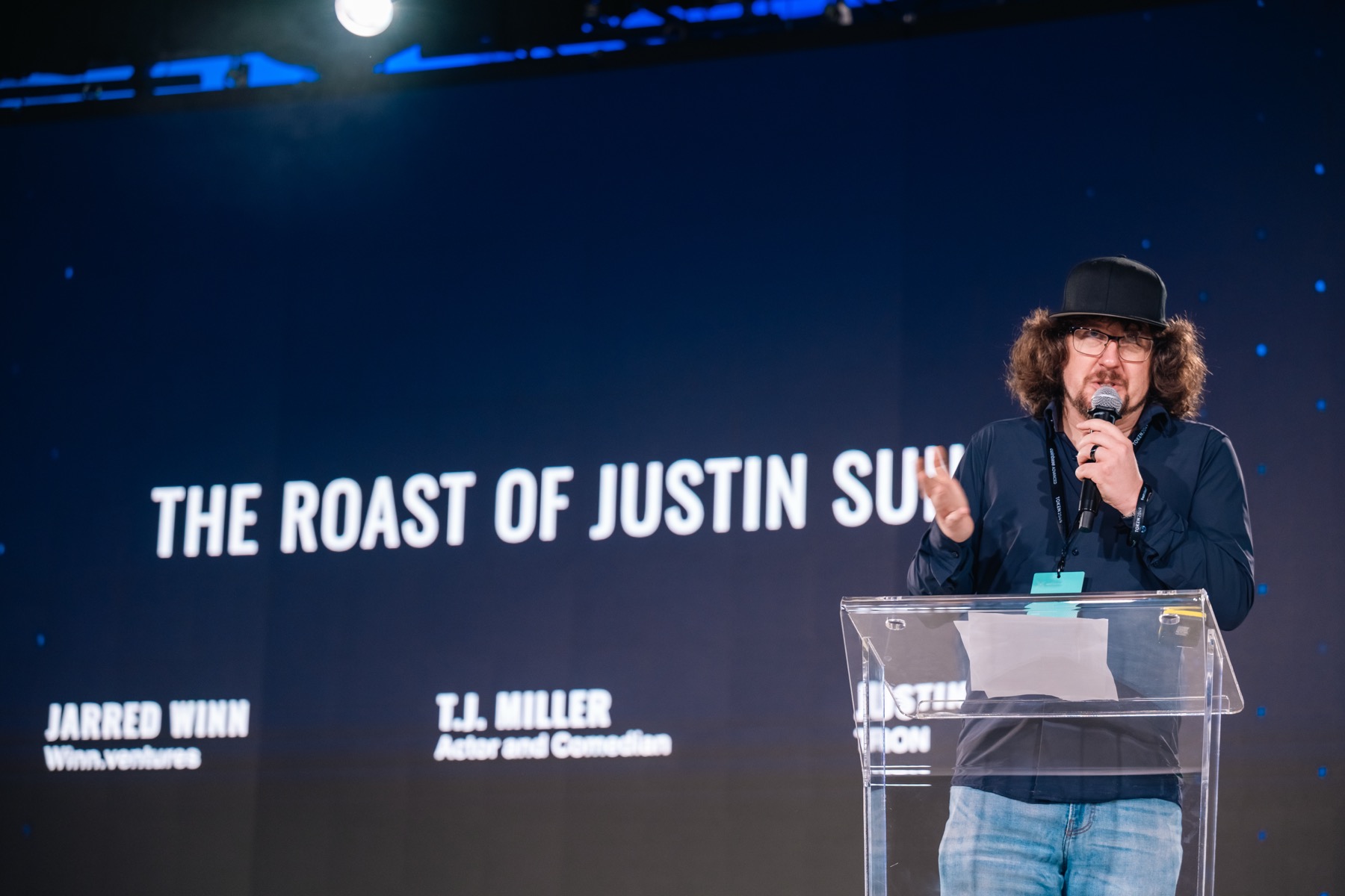 The title card at the podium